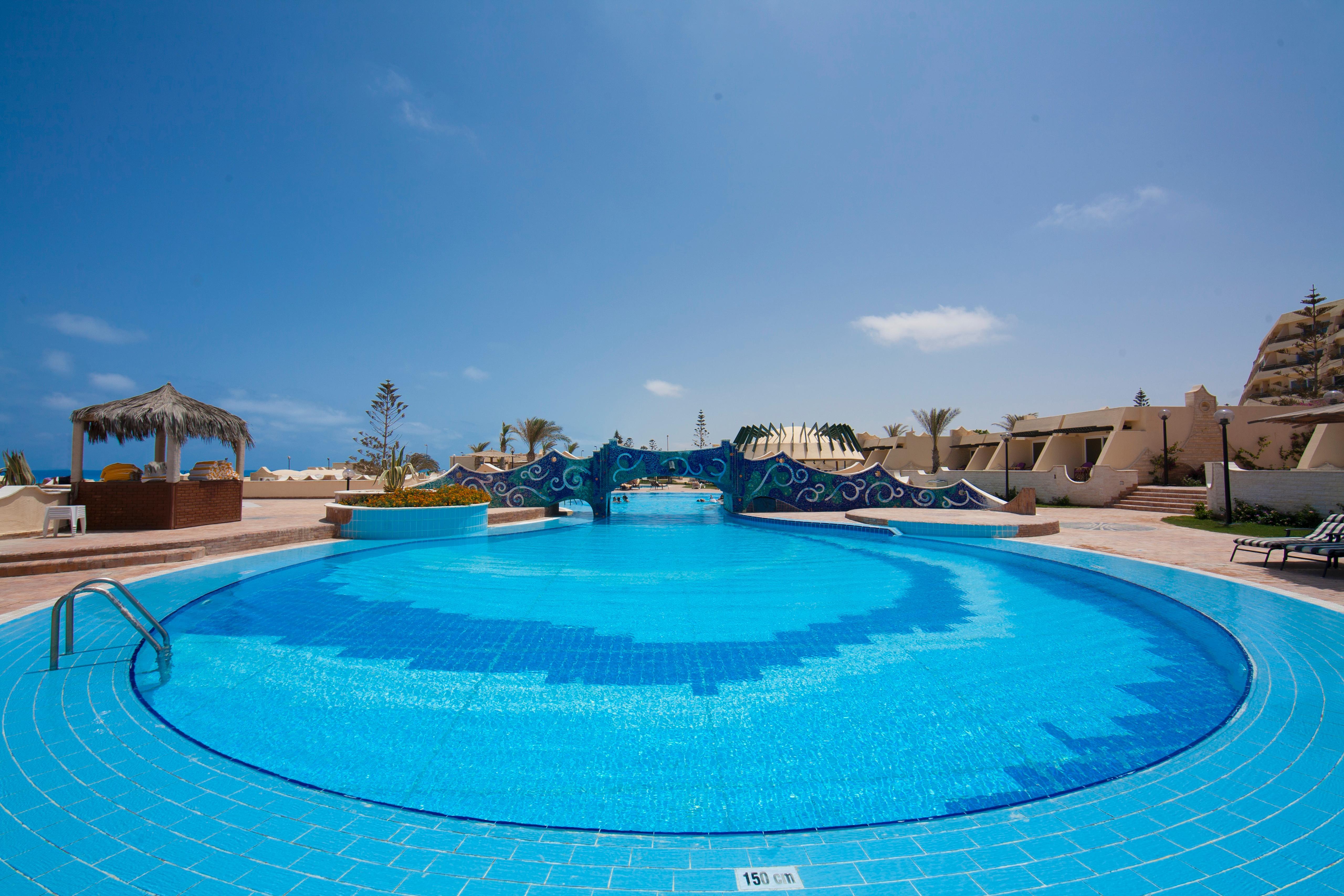 Borg El Arab Beach Resort Екстер'єр фото A swimming pool at a resort in Egypt