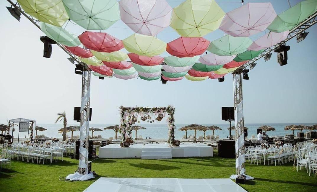 Borg El Arab Beach Resort Екстер'єр фото A canopy of umbrellas