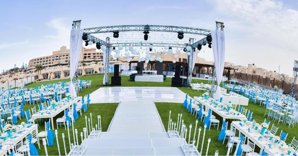 Borg El Arab Beach Resort Екстер'єр фото The lawn at the Grand Hotel